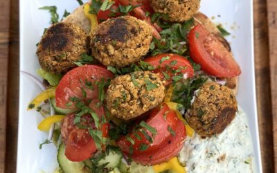 A Flavorful Falafel Plate with Tahini Sauce and Tzatziki